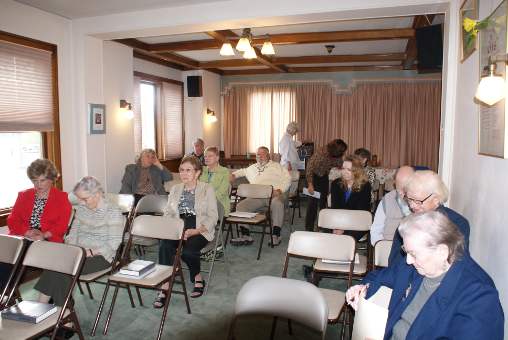 Sancturary setup with 30 chairs and information tables at back
